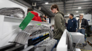 Photo of UWO engineering students receiving real-world views at Switchgear Power Systems.