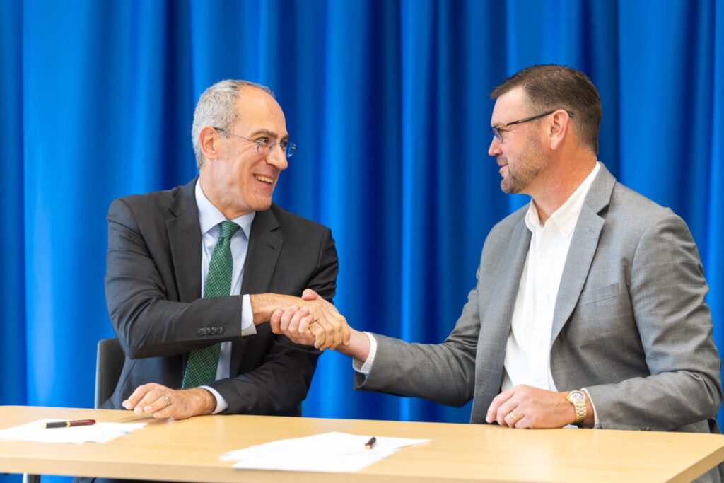 Photo of signing agreement