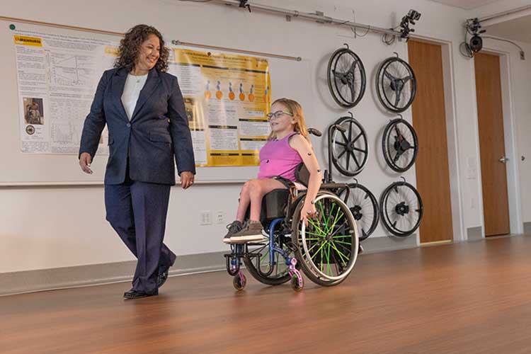Photo: Brooke Slavens, a UWM professor of mechanical engineering, is working to better understand long-term shoulder pain and musculoskeletal conditions in people who have used wheelchairs since childhood. (UWM Photo/Troye Fox)