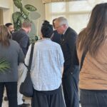 Participants conversing at the May 1, 2025, Shared Governance Council reception at Brittingham House in Madison, Wisconsin.
