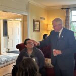 Participants conversing at the May 1, 2025, Shared Governance Council reception at Brittingham House in Madison, Wisconsin.