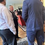 Participants conversing at the May 1, 2025, Shared Governance Council reception at Brittingham House in Madison, Wisconsin.