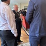 Participants conversing at the May 1, 2025, Shared Governance Council reception at Brittingham House in Madison, Wisconsin.
