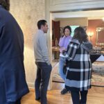 Participants conversing at the May 1, 2025, Shared Governance Council reception at Brittingham House in Madison, Wisconsin.