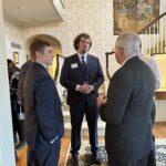 Participants conversing at the May 1, 2025, Shared Governance Council reception at Brittingham House in Madison, Wisconsin.