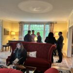 Universities of Wisconsin participants conversing at the May 1, 2025, Shared Governance Council reception at Brittingham House in Madison, Wisconsin.
