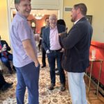 Universities of Wisconsin participants conversing at the May 1, 2025, Shared Governance Council reception at Brittingham House in Madison, Wisconsin.