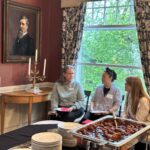 Universities of Wisconsin participants conversing at the May 1, 2025, Shared Governance Council reception at Brittingham House in Madison, Wisconsin.