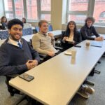 Universities of Wisconsin participants smiling at the May 2, 2025, Shared Governance Council meeting at the Pyle Center in Madison, Wisconsin.