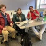 Universities of Wisconsin participants smiling and gesturing at the May 2, 2025, Shared Governance Council meeting at the Pyle Center in Madison, Wisconsin.