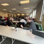 Universities of Wisconsin participants conversing at the May 2, 2025, Shared Governance Council meeting at the Pyle Center in Madison, Wisconsin.