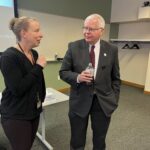 Sheryl Zajdowicz and President Jay Rothman of the Universities of Wisconsin conversing at the May 2, 2025, Shared Governance Council meeting at the Pyle Center in Madison, Wisconsin.