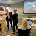 Universities of Wisconsin participants conversing at the May 2, 2025, Shared Governance Council meeting at the Pyle Center in Madison, Wisconsin.