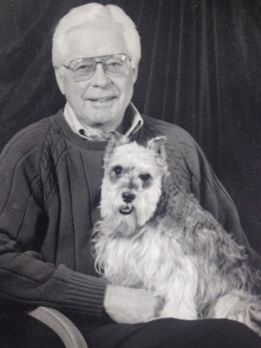 Portrait of James R. Underkofler with his little jack russell terrier.